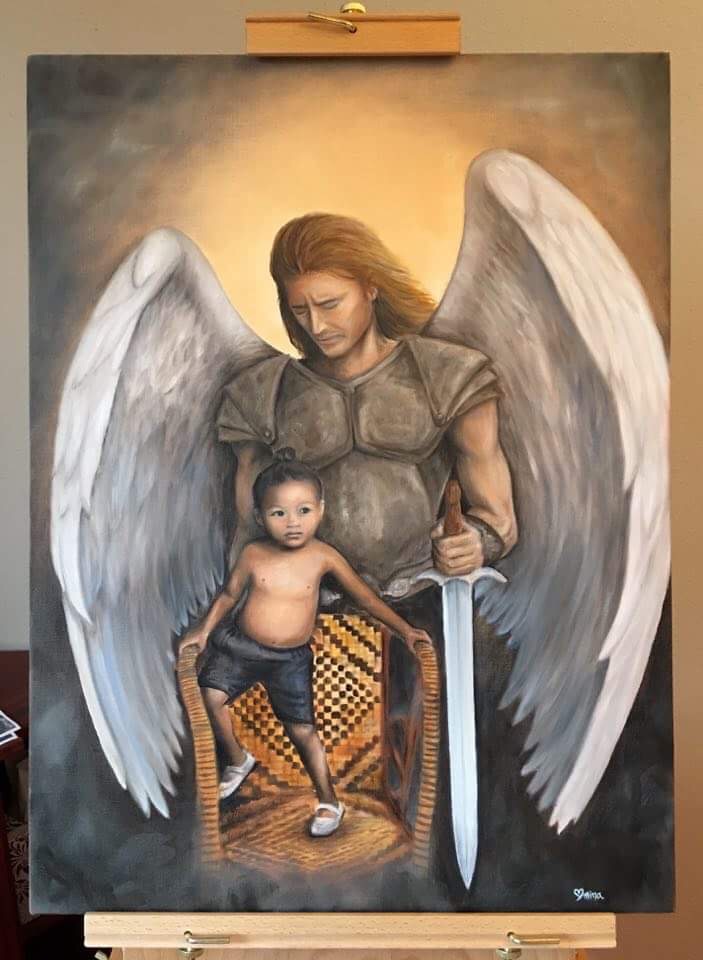 baby thuy in a picture with a painting
